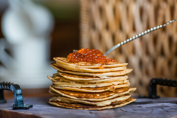 Banner. Delicious pancakes with red caviar. Russian and Ukrainian cuisine. The concept of the...