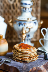 Banner. Delicious pancakes with red caviar. Russian and Ukrainian cuisine. The concept of the Maslenitsa holiday.