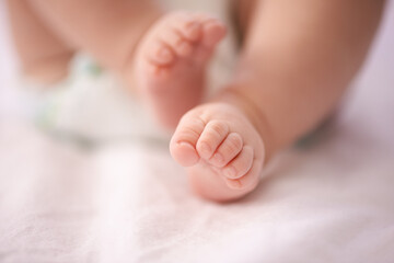 Obraz na płótnie Canvas Tiny toes. A cropped shot of a babys feet.