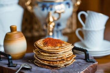 Banner. Delicious pancakes with red caviar. Russian and Ukrainian cuisine. The concept of the...