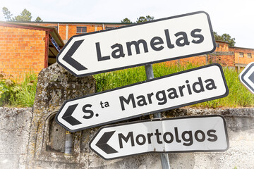 traffic signpost pointing the way to Lamelas, Santa Margarida and Mortolgos - Castro Daire, district of Viseu, Portugal - obrazy, fototapety, plakaty