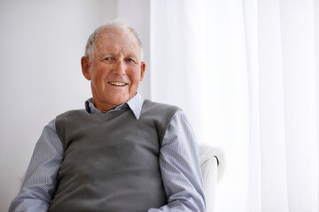 Positive attitudes are the way to go. Portrait of a smiling senior man relaxing in a chair.