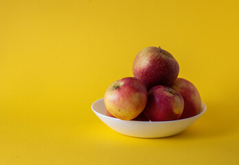 apples in a plate on the background
