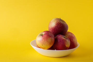 apples in a plate on the background
