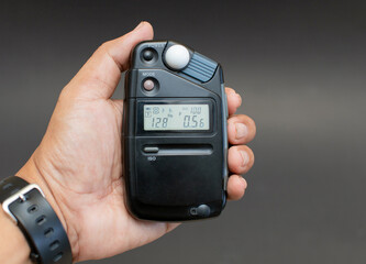 Light meter for photography in a black background.