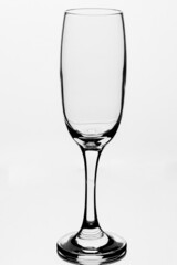 Empty glass of champagne in white background