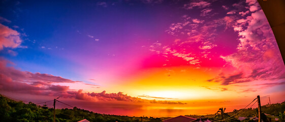 Extraordinary colors of a sunset in Reunion Island due to particles emitted by the Tunga Hunga...