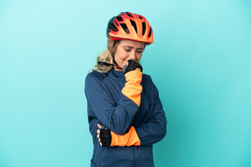 Young cyclist woman isolated on blue background having doubts