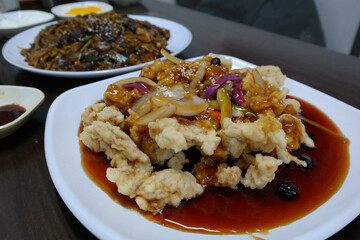 set menu of sweet and sour pork and noodles in black bean sauce