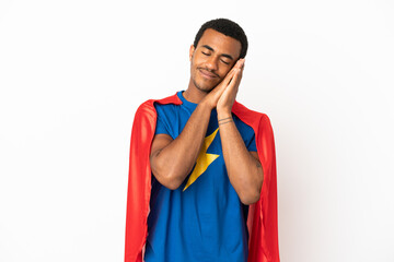 African American Super Hero man over isolated white background making sleep gesture in dorable expression © luismolinero