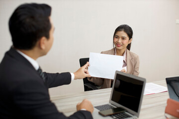 Obraz premium Collaborative process of professional businesspeople going over on new project, using paperwork and computer presentation with brainstorming ideas, coworker and work together at office meeting concept