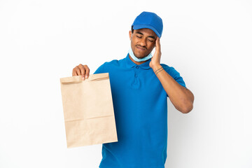 Fototapeta na wymiar African American man taking a bag of takeaway food isolated on white background with headache