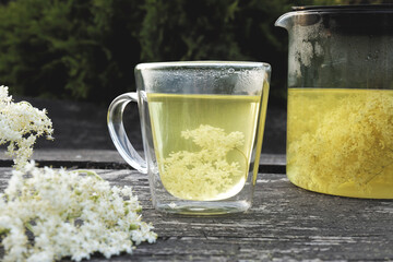 Elder flower tea infusion. Healthy natural hot drink from elderberry (Sambucus nigra) plant.