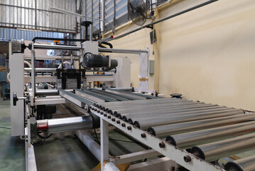 Close up Machine in Paper Box Manufacturer. industrial Concept