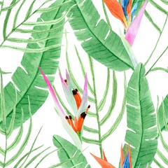 Seamless pattern with watercolor green palm leaves and colorful flowers on a white background. Tropic motif.