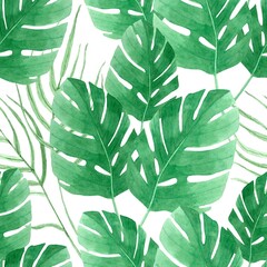 Seamless pattern with watercolor green palm leaves on a white background. Tropic motif.