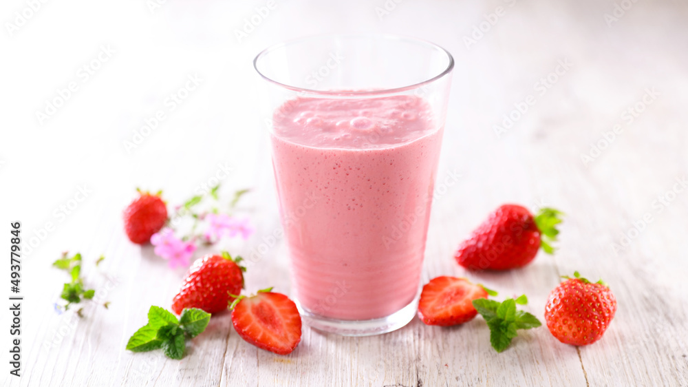 Wall mural strawberry smoothie in glass with strawberries