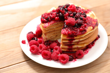 stack of pancakes with berries fruits