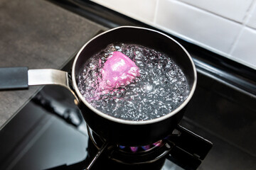 Boiling the menstrual cup to clean it. Sterilisation removes all impurities and germs.Alternative...