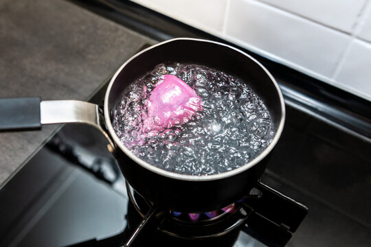 Boiling the menstrual cup to clean it. Sterilisation removes all impurities and germs.Alternative feminine hygiene product concept during menstruation.Zero waste and reusable, environmentally friendly