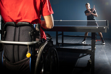 Fototapeta premium Wheelchair user playing table tennis