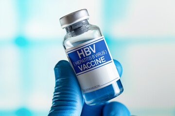 Doctor with vial of the doses vaccine for HBV against Hepatitis B Virus disease. Vaccination and health care concept. Vaccination for booster shot for HBV against Hepatitis B Virus in the babies - obrazy, fototapety, plakaty