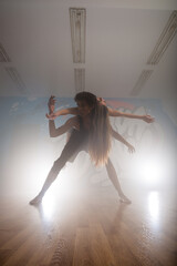 Group of multiracial dancers are exercising and practicing in their studio in slow motion