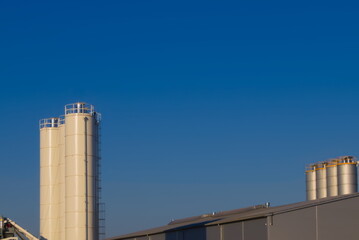 huge silos against the blue sky