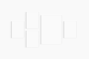 Gallery wall mockup. Set of 5 white frames. Gallery wall frame mockup. One 50x70 (5:7) and four 30x40 (3:4) white frames.