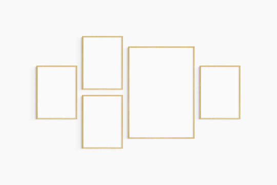 Gallery wall mockup. Set of 5 oak wood frames. Gallery wall frame mockup. One 50x70 (5:7) and four 30x40 (3:4) wooden frames.