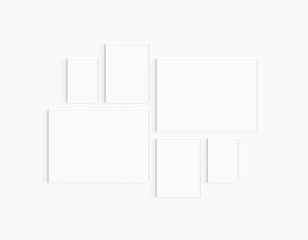 Gallery wall mockup. Set of 6 white frames. Gallery wall frame mockup. Two 70x50 (7:5), two 30x40 (3:4), and two A4 (5:7) white frames.