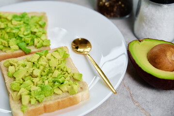Toasts with avocado on white plate, Healthy food and dieting concept, Organic product