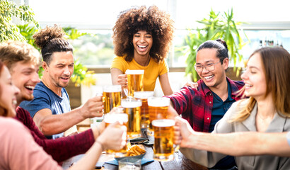Young trendy people drinking and toasting beer at brewery bar restaurant - Beverage life style...