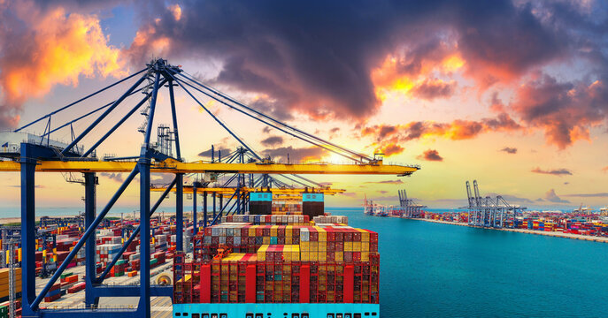 Panorama of cargo ship and cargo container in harbor.