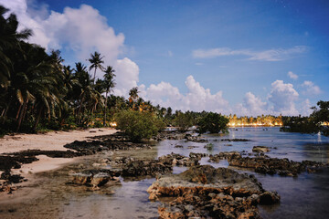 Beautiful seascape with cloudy sky with stars. Night on the tropical beach.