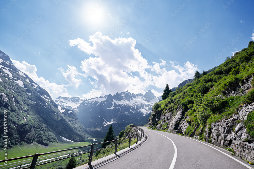 Wall mural asphalt road in alp mountains. road trip concept. beautiful landscape.