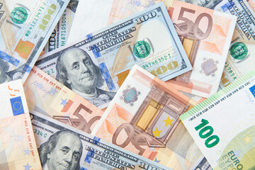 Fototapeta na wymiar Dollars and Euros bills background. Currency background. Heap of american dollars and europe euro. Currency exchange concept. top view.
