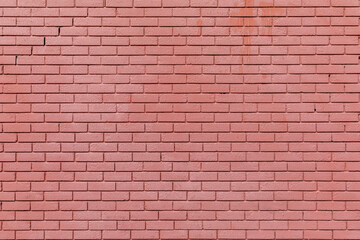 A brick wall painted with red paint, background texture 