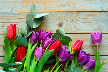 Old grey wooden background with purple and red summer spring decoration border in a line and empty copy space mock up layout