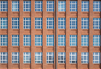 Facade from an tall old brick building 