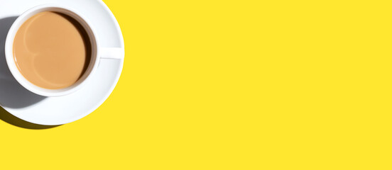 A cup of coffee overhead view on desk - flat lay