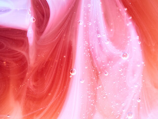 Waves and bubbles pattern made with liquid soap, pink and light purple background, horizontal image