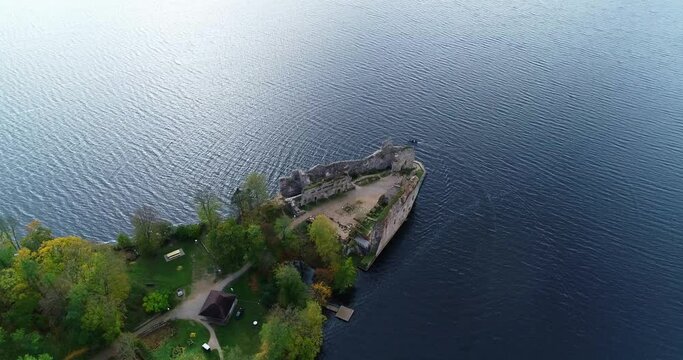 Aerial view of an old stone castle ruins in Koknese, Latvia. Located on a peninsula near the Daugava river and Perse river.