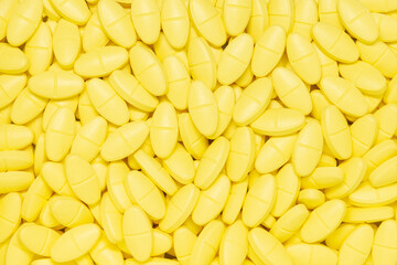 Yellow pills background.