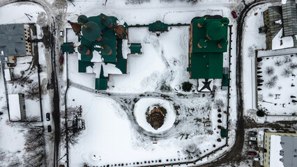 Drone view of a beautiful church in the snow. Ancient architecture. Snow day.