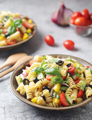 A bowl with traditional Italian pasta salad