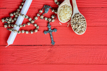 Christian cross necklace on dark background - as a symbol of the beginning of Great Lent, Ash Wednesday	
