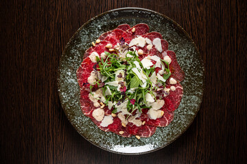 carpaccio with arugula salad