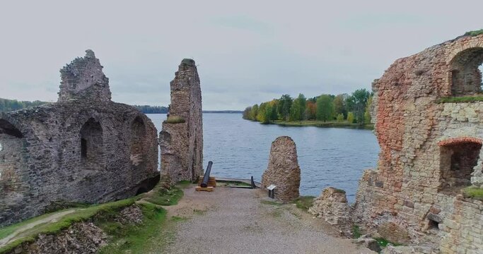 Aerial view of an old stone castle ruins in Koknese, Latvia. Located on a peninsula near the Daugava river and Perse river.