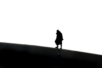 silhouette of a person on a mountain and healso look like Gandhi 